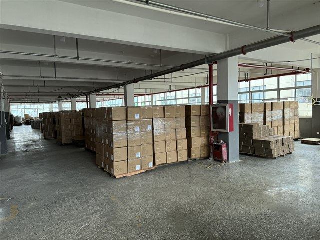Factory carton and packing area for belt packaging and shipment review