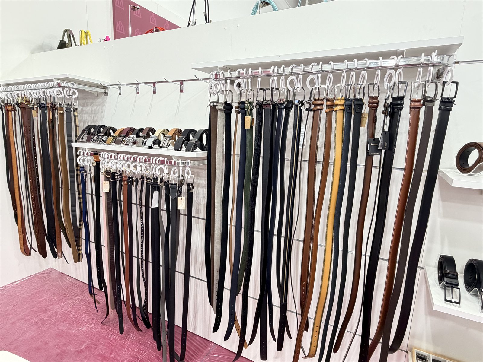 Leather and woven belt samples displayed at the LEBO trade show booth