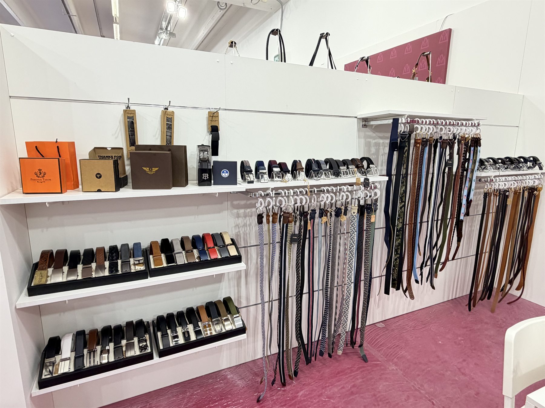 LEBO belt collection and private-label packaging displayed at the Italy trade show